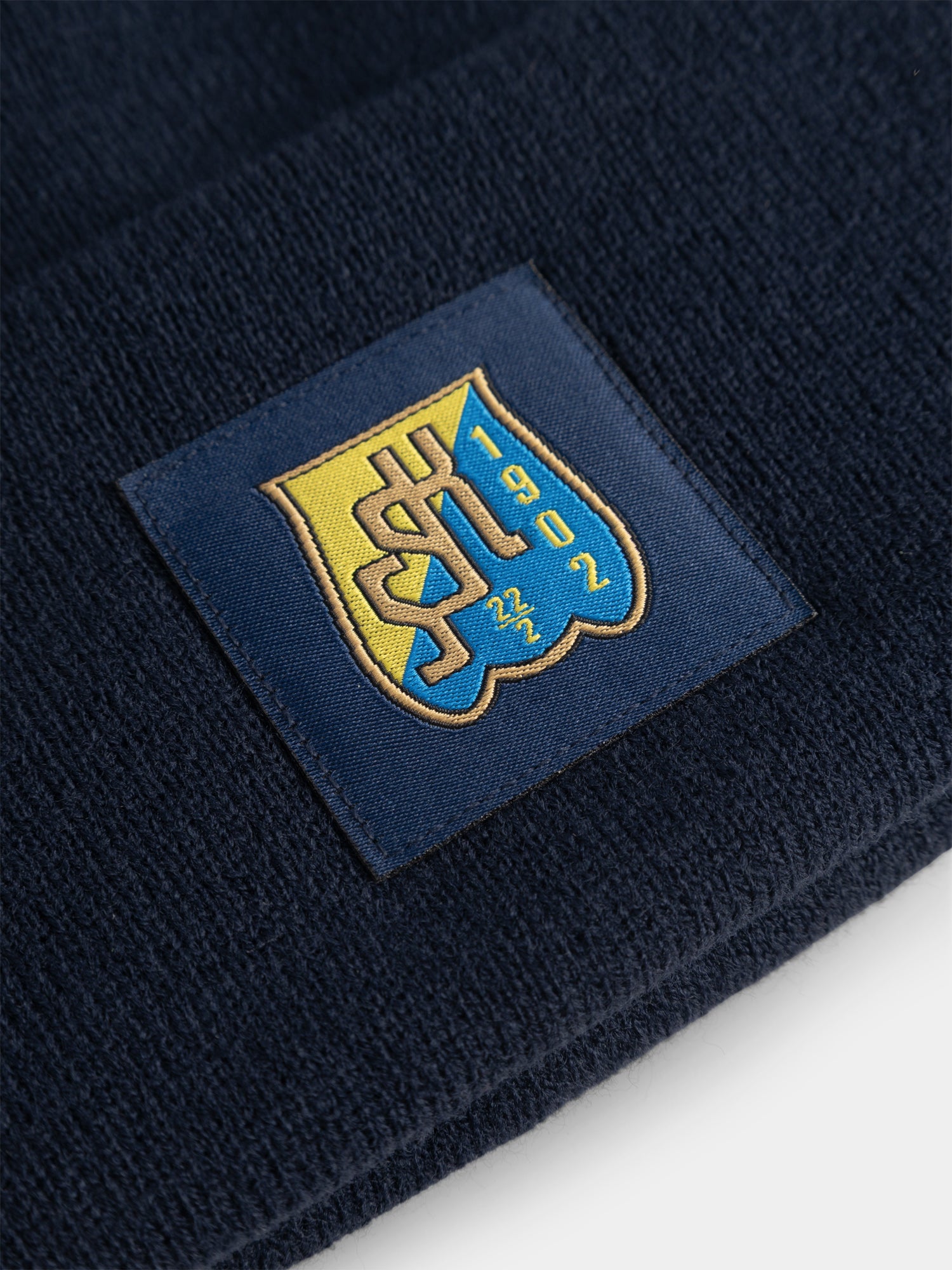 Stickad mössa Fold Tassen
